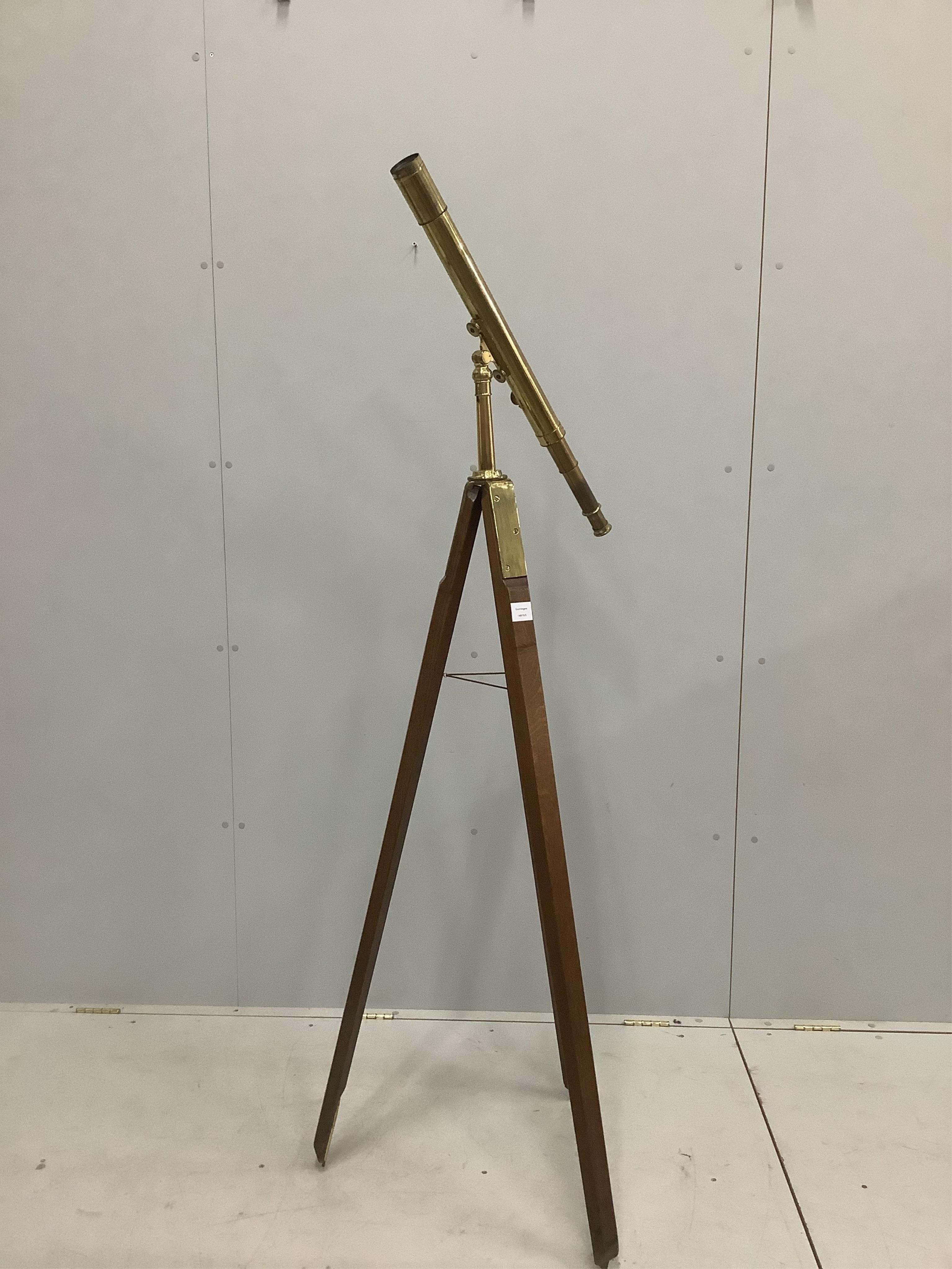 A late 19th century brass two draw telescope, by J. H. Steward, on oak tripod stand, 56cm. Condition - fair, some parts seized